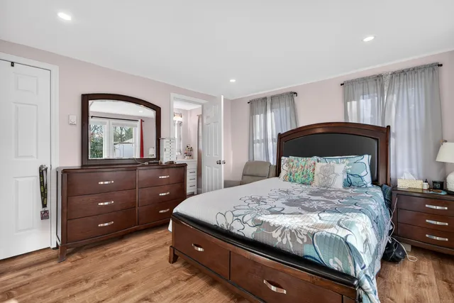 a bedroom with a bed and a dresser