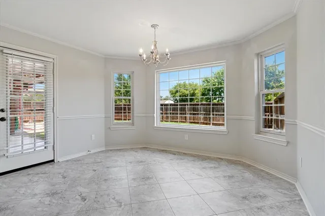 a view of an empty room with windows