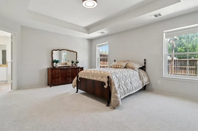 a bedroom with a bed and a table