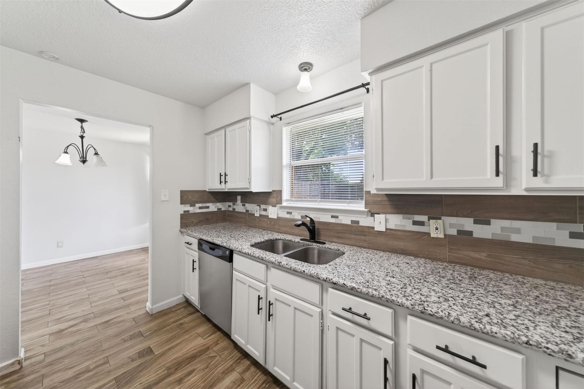 17002 Dew Drop Lane Houston, TX 77095 - Photo 9 of 24 a kitchen with a sink and cabinets