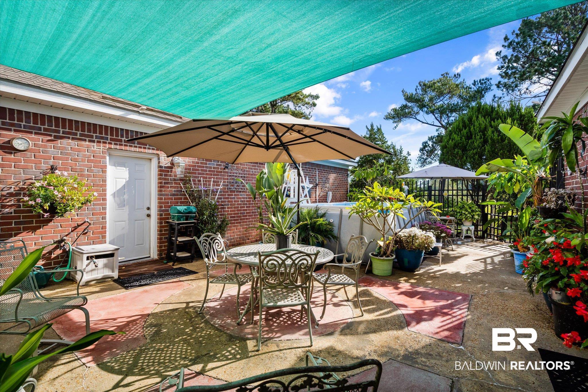 3837 St Andrews Loop East Mobile, AL 36693 - Photo 11 of 22 Patio accesses living, downstairs suite and garage