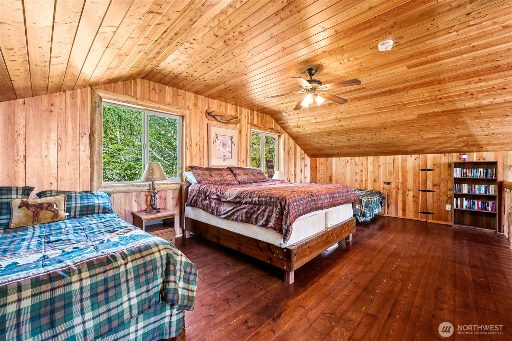 0 Boyd Road Randle, WA 98377 - Photo 18 of 39 a bedroom with a large bed a chandelier and next to a window