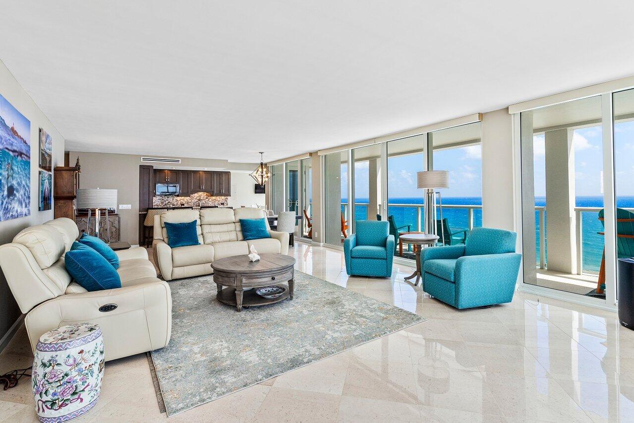 2800 South Ocean Boulevard, Unit 22M Boca Raton, FL 33432 - Photo 5 of 29 a living room with furniture and a large window
