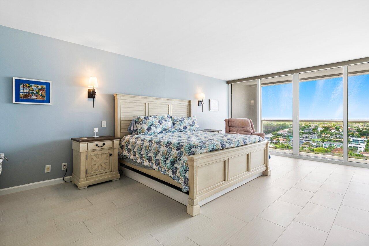 2800 South Ocean Boulevard, Unit 22M Boca Raton, FL 33432 - Photo 9 of 29 a spacious bedroom with a bed and a large window