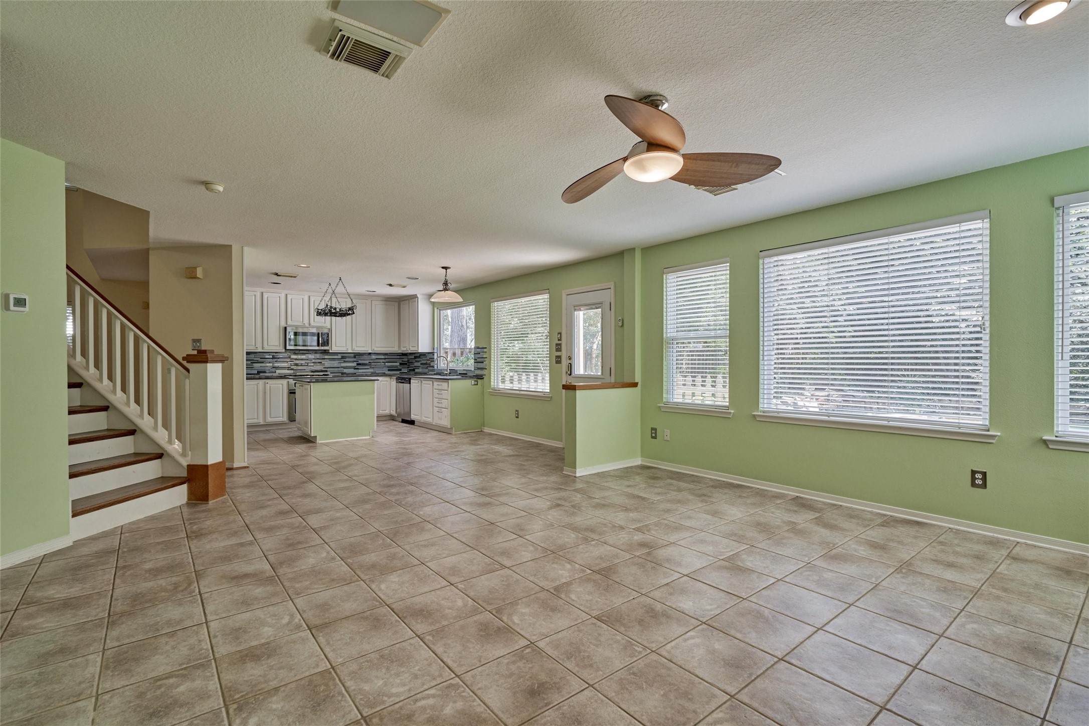 59 West Gaslight Place Spring, TX 77382 - Photo 17 of 47 View of stairs and kitchen area
