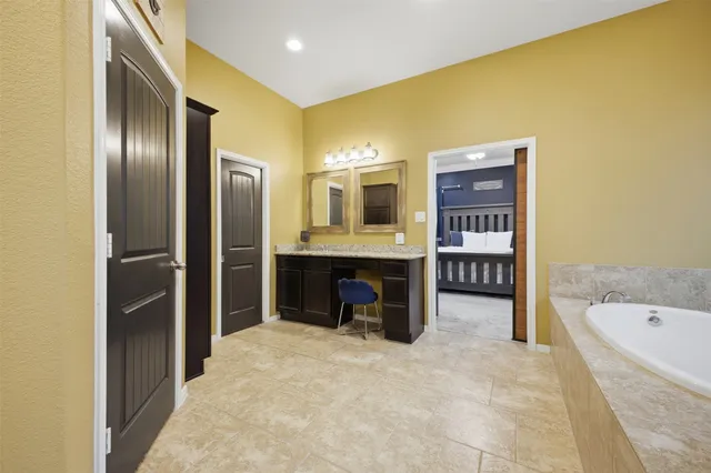 a living room with furniture and kitchen view