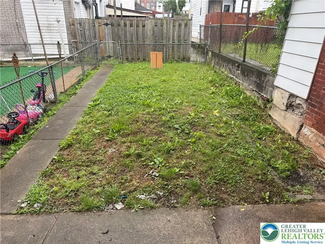 a view of garden with wooden stairs