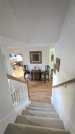 a bedroom with furniture and a wooden floor
