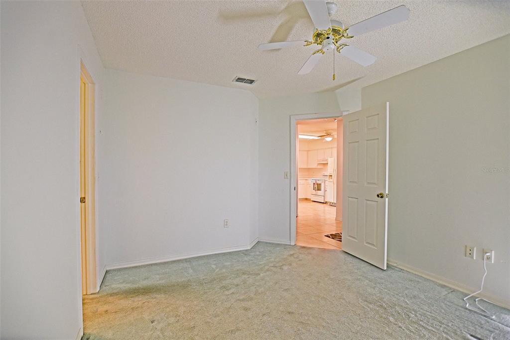 10046 Southeast 175 Street Summerfield, FL 34491 - Photo 22 of 27 a view of an empty room with a window