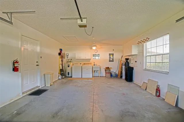a view of a storage & utility room with a washer dryer