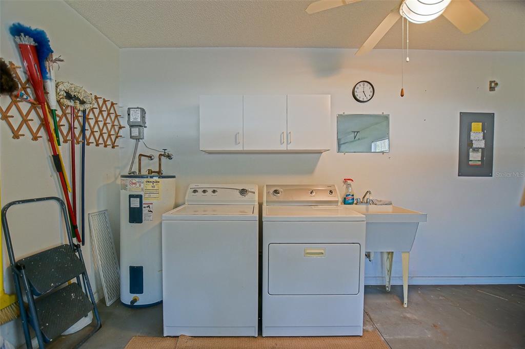 10046 Southeast 175 Street Summerfield, FL 34491 - Photo 27 of 27 a view of a storage & utility room with a washer dryer
