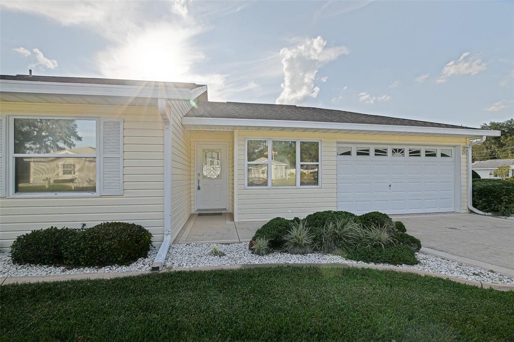 10046 Southeast 175 Street Summerfield, FL 34491 - Photo 7 of 27 a front view of a house with a yard