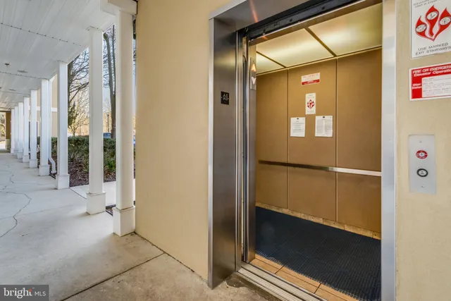an aerial view of residential building with ocean view