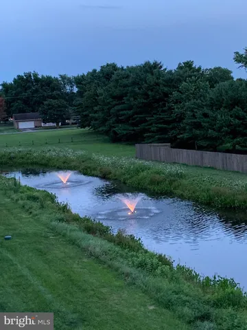 an aerial view of residential building and lake
