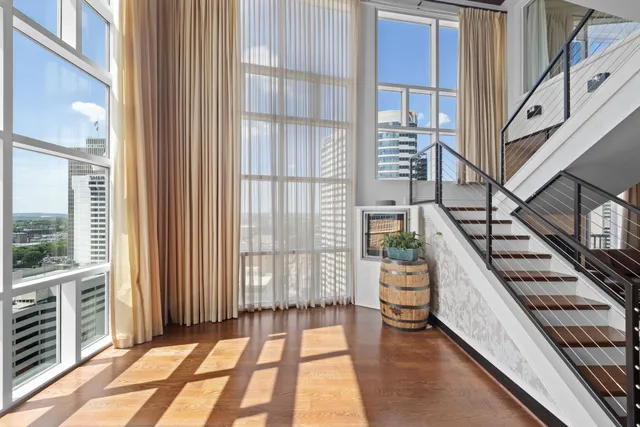 a view of an entryway with wooden floor and windows