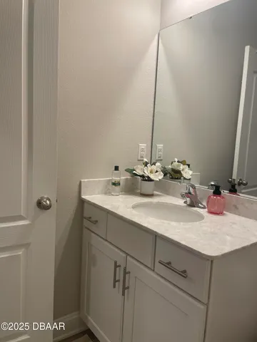 a white toilet sitting next to a shower curtain