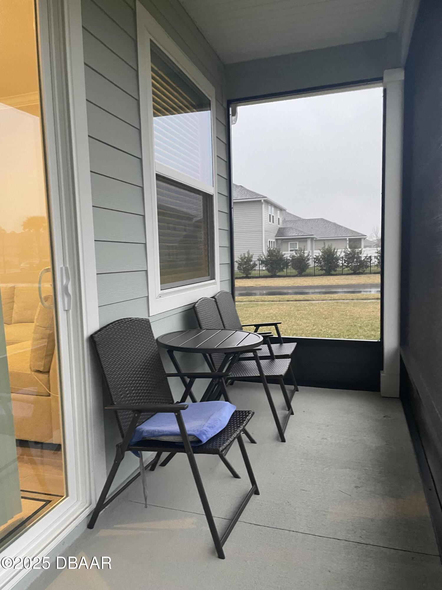 181 Thistleton Way St. Augustine, FL 32092 - Photo 24 of 31 a balcony with table and chairs