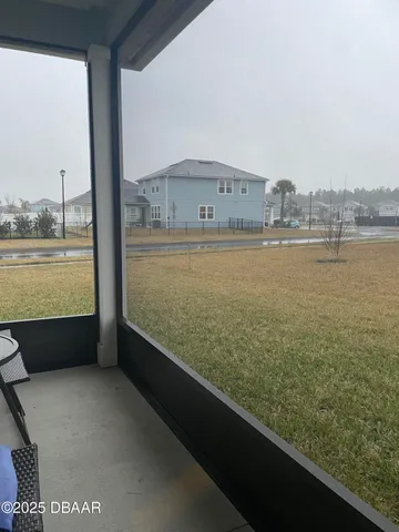 an empty room with wooden floor and window