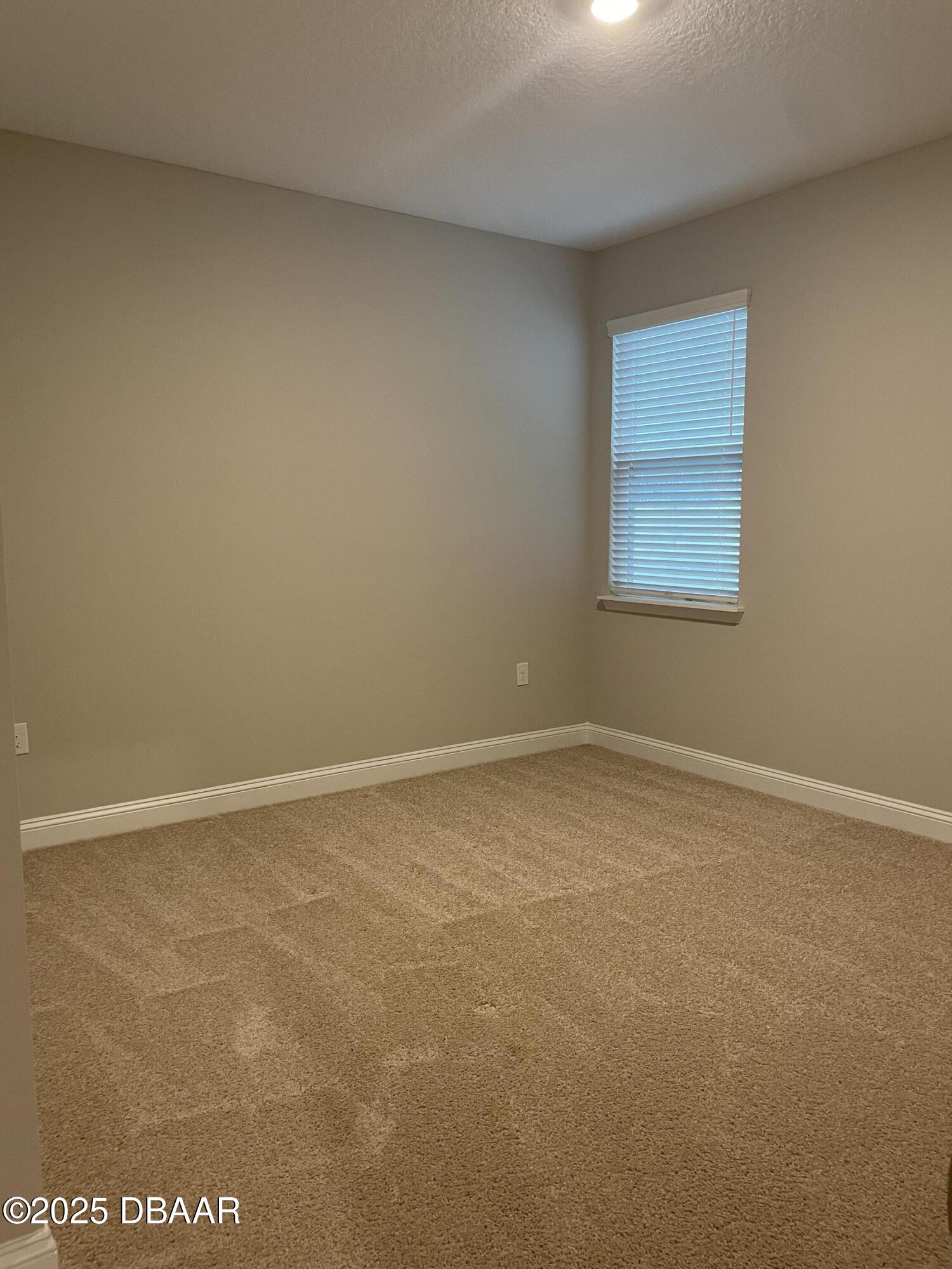 181 Thistleton Way St. Augustine, FL 32092 - Photo 28 of 31 a view of an empty room with a window