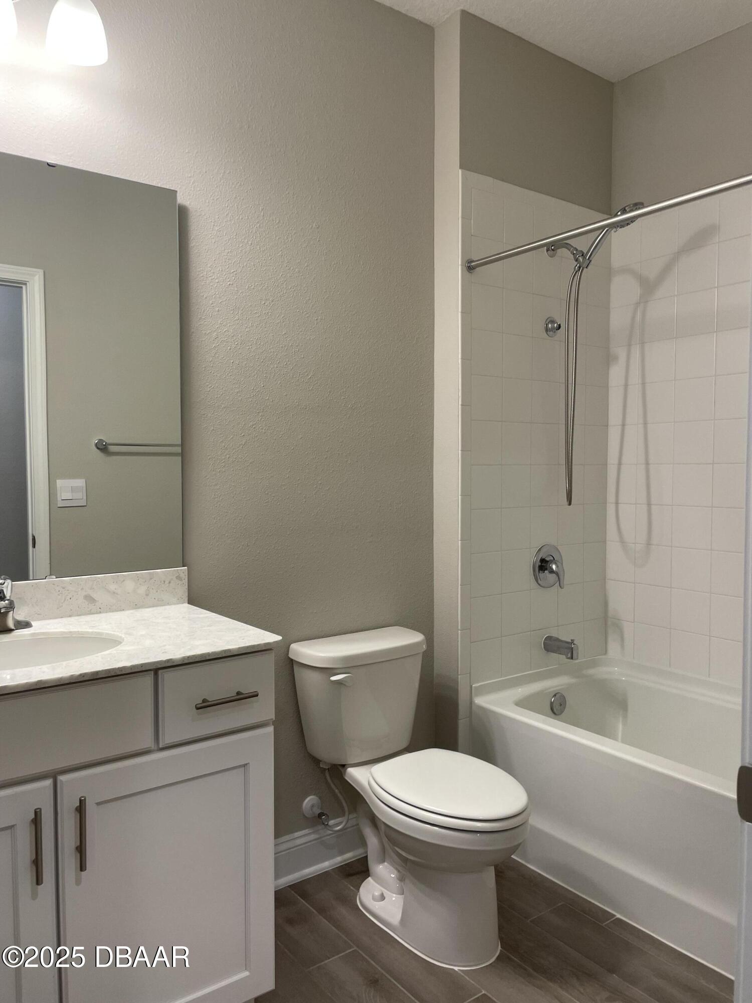 181 Thistleton Way St. Augustine, FL 32092 - Photo 29 of 31 a bathroom with a toilet a sink and a bathtub