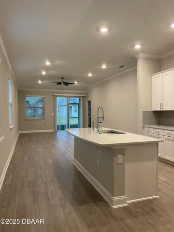 a kitchen with a sink and cabinets