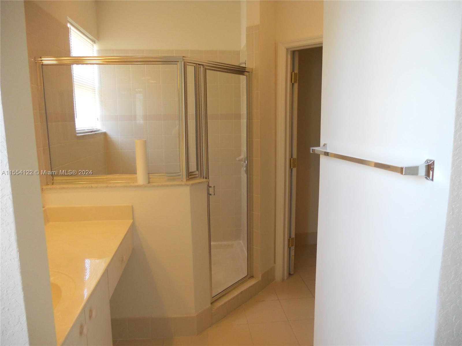 2017 Southeast 15th Street Homestead, FL 33035 - Photo 8 of 20 a bathroom with a shower and a tub