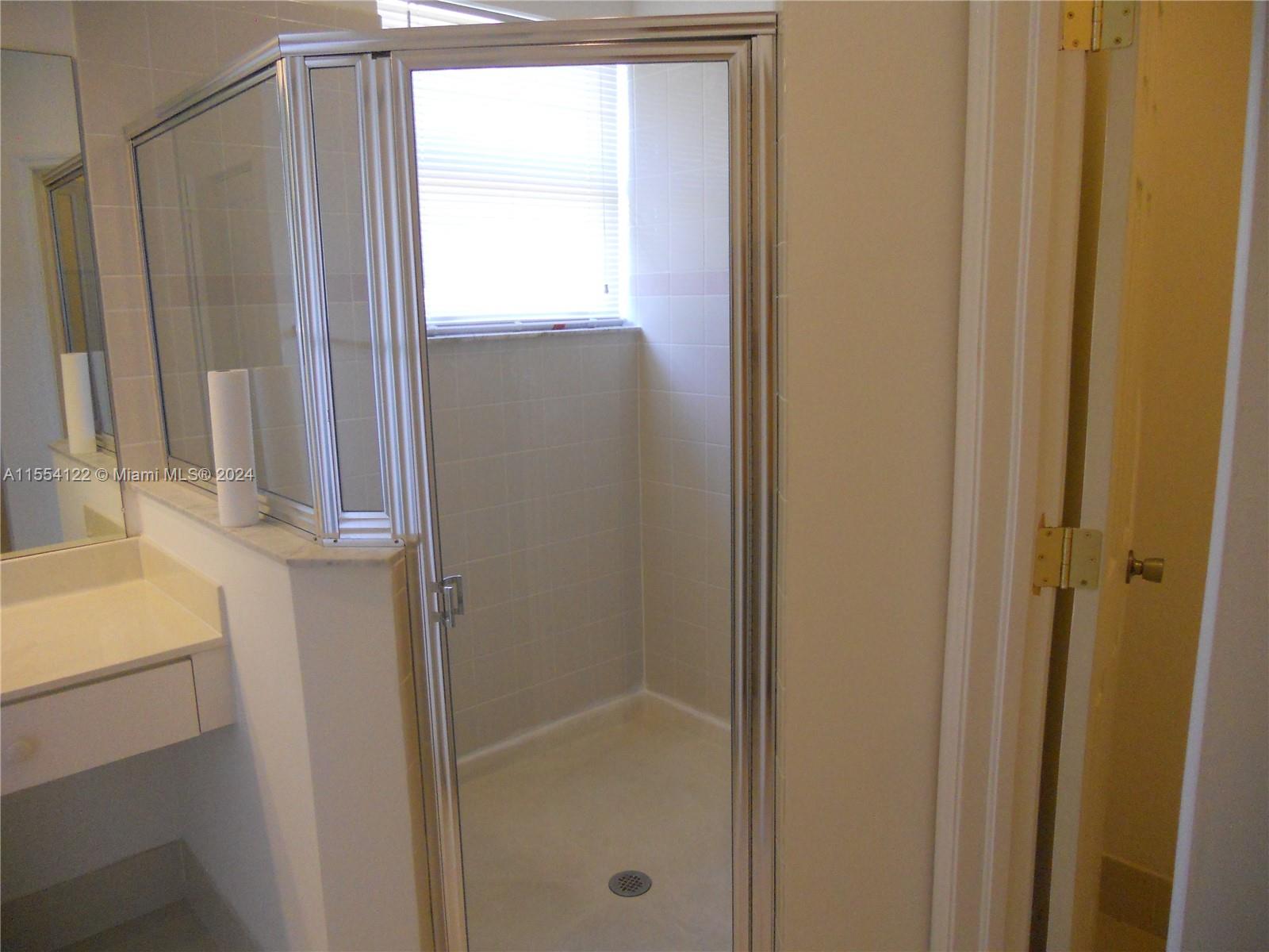 2017 Southeast 15th Street Homestead, FL 33035 - Photo 9 of 20 a bathroom with a shower and a sink
