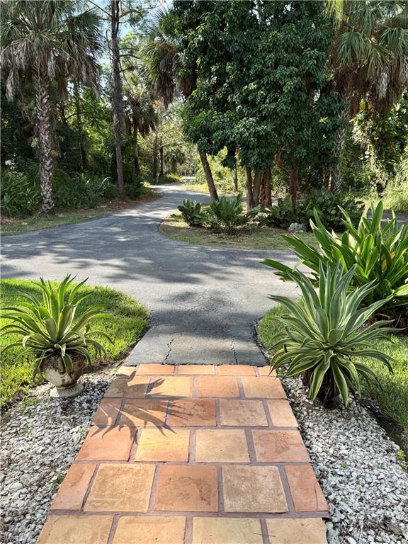 410 6th Street Northeast Naples, FL 34120 - Photo 12 of 32 View of street from covered front porch.