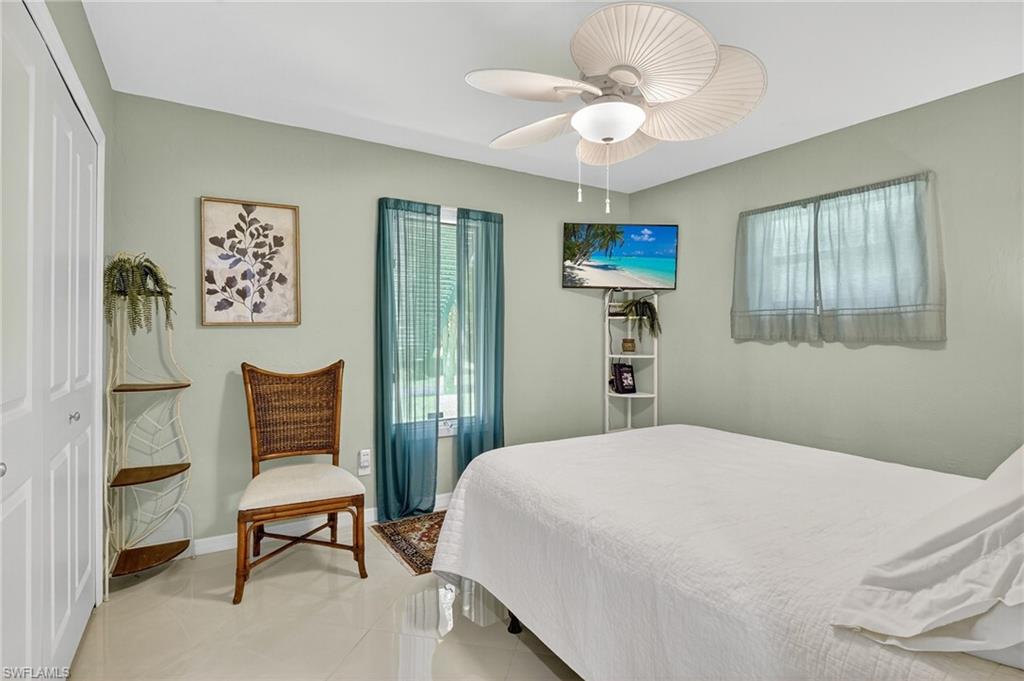 410 6th Street Northeast Naples, FL 34120 - Photo 22 of 32 2nd Bedroom includes mounted corner TV.