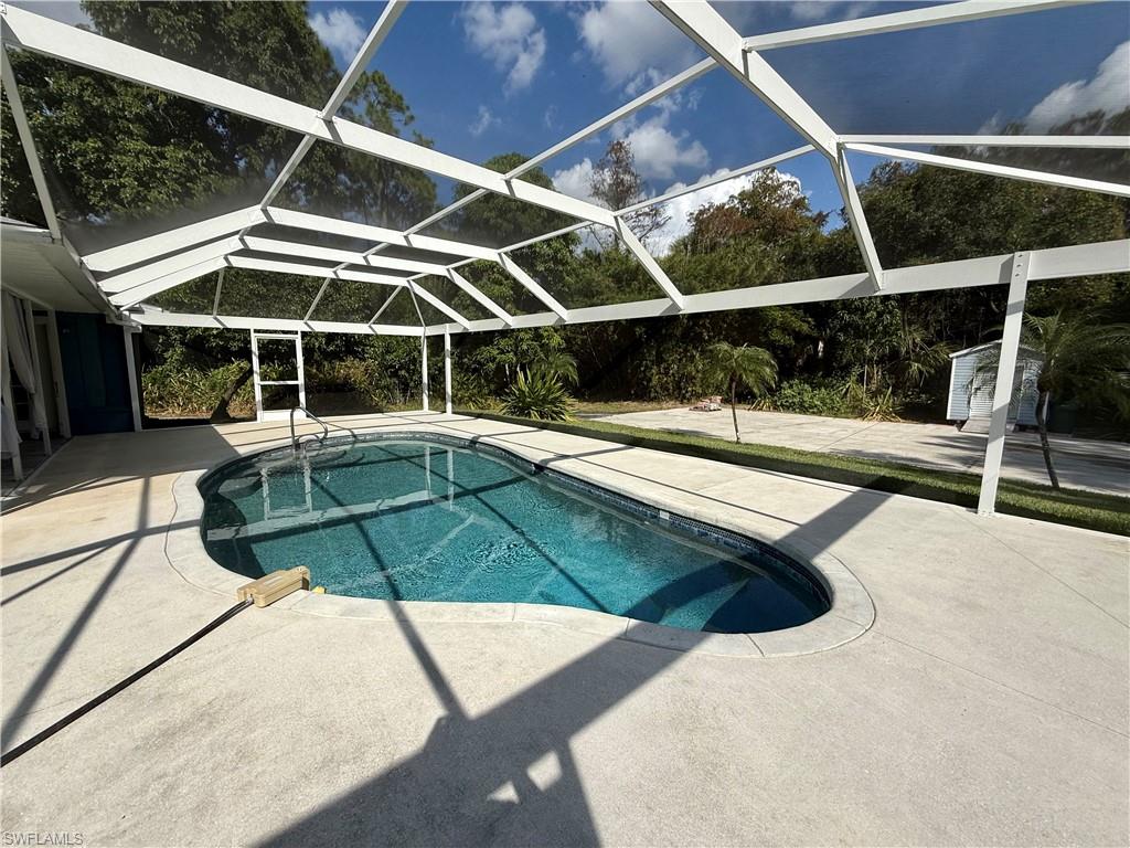 410 6th Street Northeast Naples, FL 34120 - Photo 3 of 32 Remodeled pool area with new equipment, new noseum seemless screen!