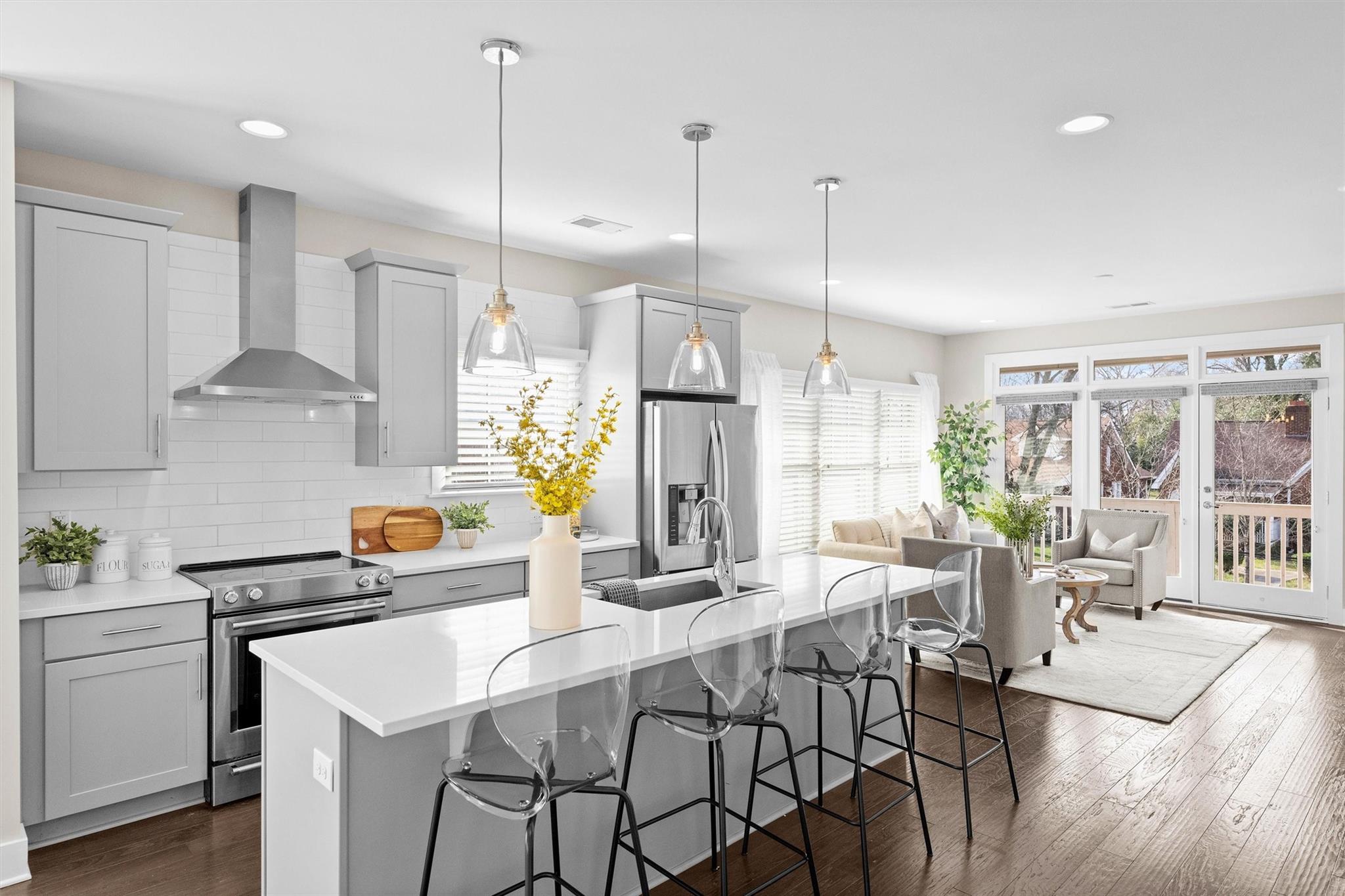 131 Grandin Road Charlotte, NC 28208 - Photo 11 of 45 a kitchen with stainless steel appliances kitchen island granite countertop a table chairs and a wooden floor
