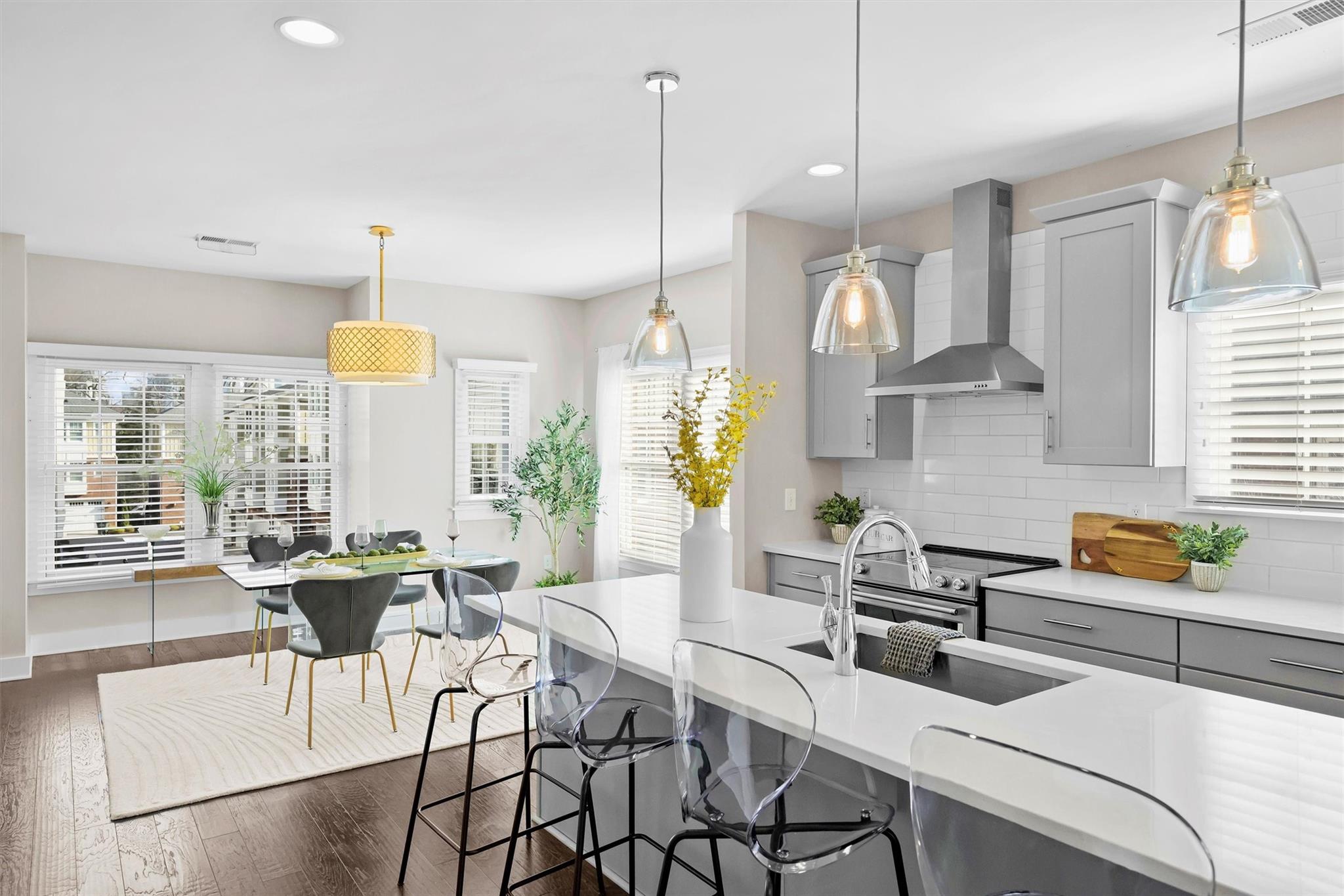 131 Grandin Road Charlotte, NC 28208 - Photo 21 of 45 a kitchen with stainless steel appliances a table and chairs