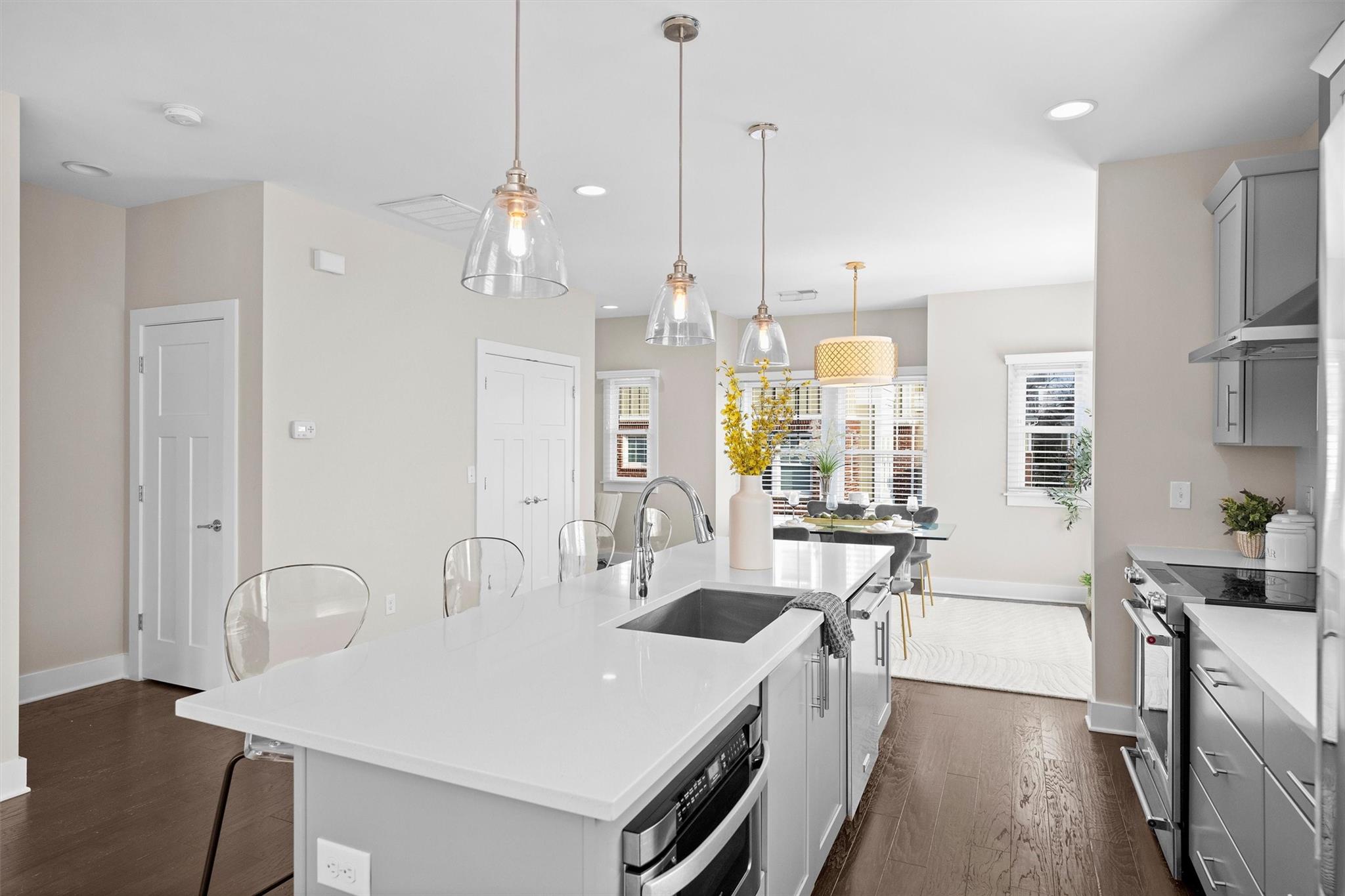 131 Grandin Road Charlotte, NC 28208 - Photo 26 of 45 a large kitchen with stainless steel appliances a large center island attached withe living room