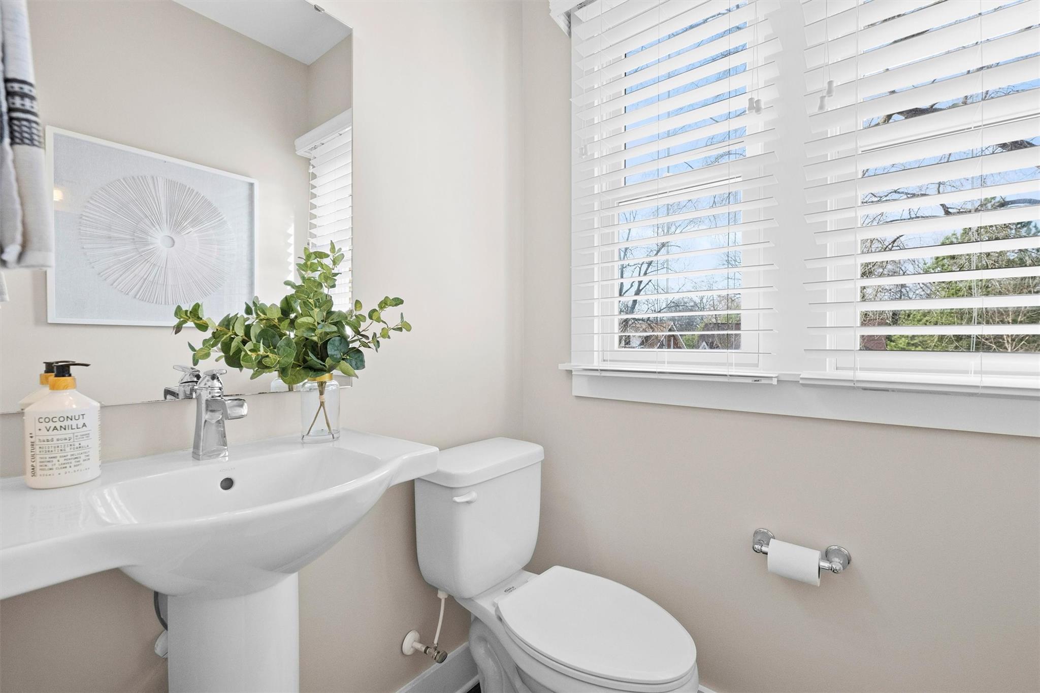 131 Grandin Road Charlotte, NC 28208 - Photo 29 of 45 a bathroom with a sink a mirror and a toilet