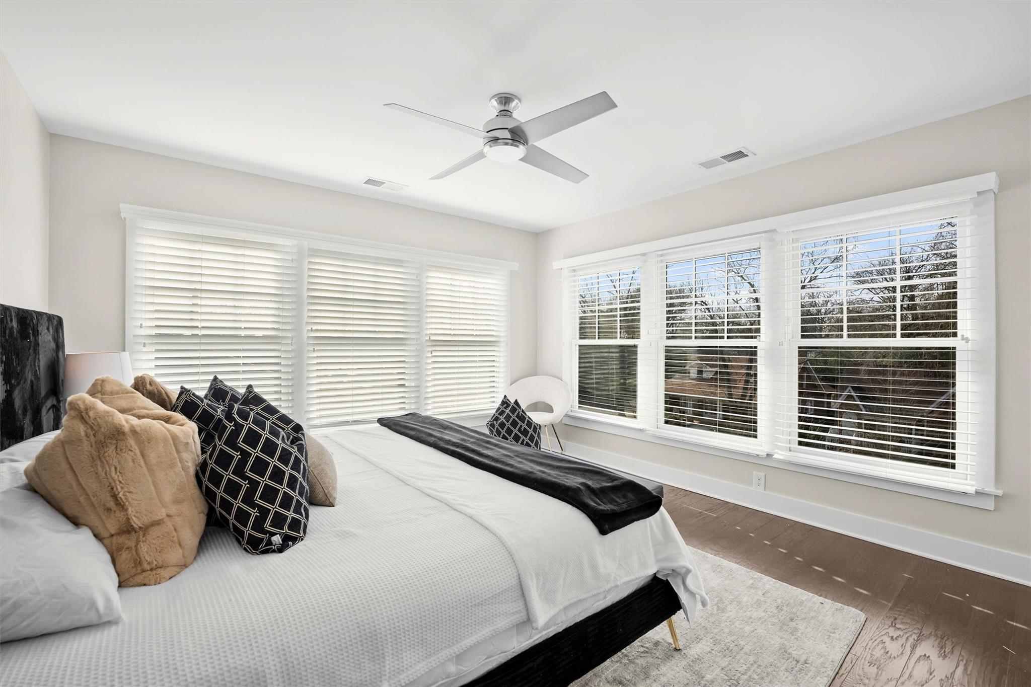 131 Grandin Road Charlotte, NC 28208 - Photo 31 of 45 a bedroom with a bed and a large window