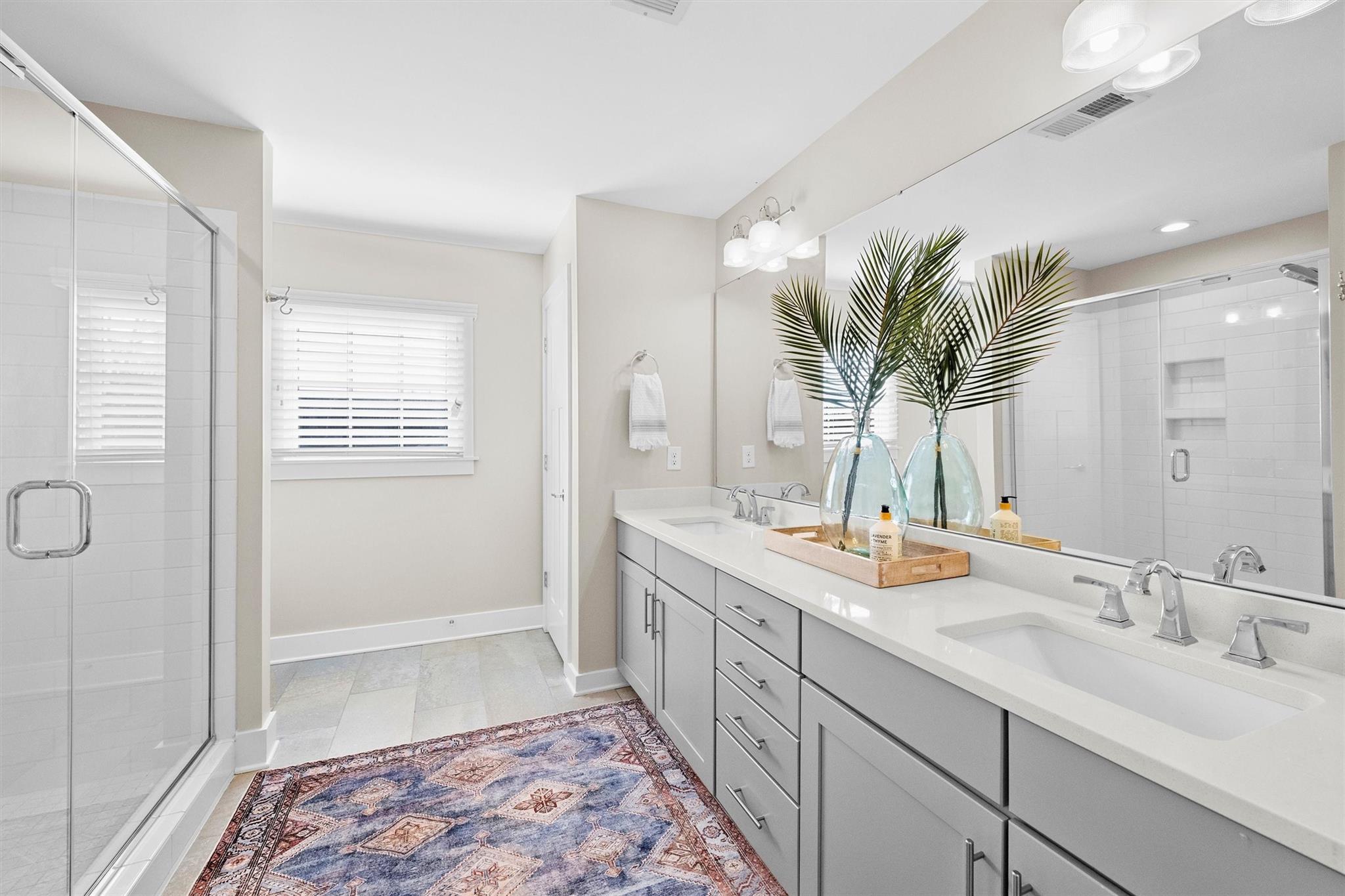 131 Grandin Road Charlotte, NC 28208 - Photo 33 of 45 a spacious bathroom with a double vanity sink and a mirror