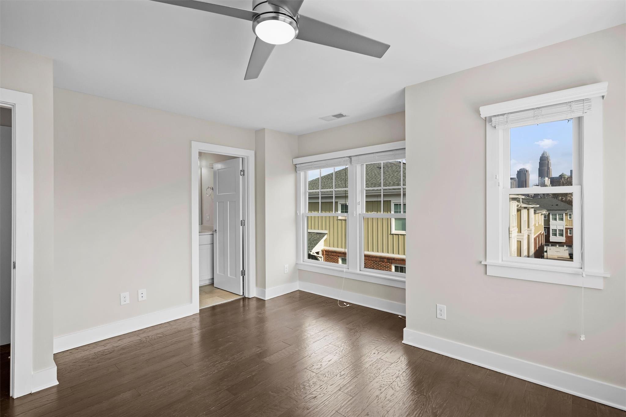 131 Grandin Road Charlotte, NC 28208 - Photo 37 of 45 a view of an empty room with wooden floor and a window