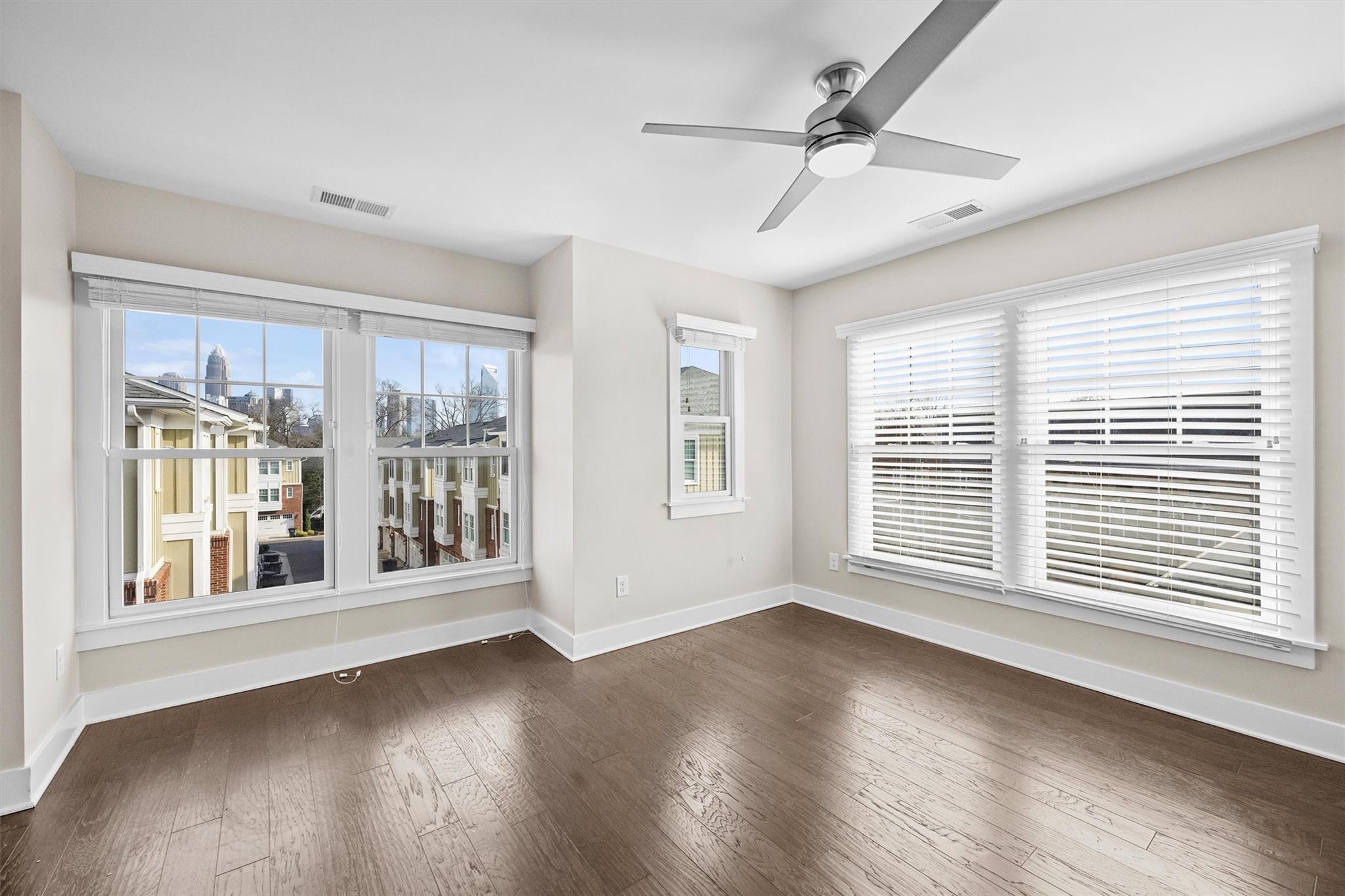 131 Grandin Road Charlotte, NC 28208 - Photo 38 of 45 a view of an empty room with wooden floor and a window
