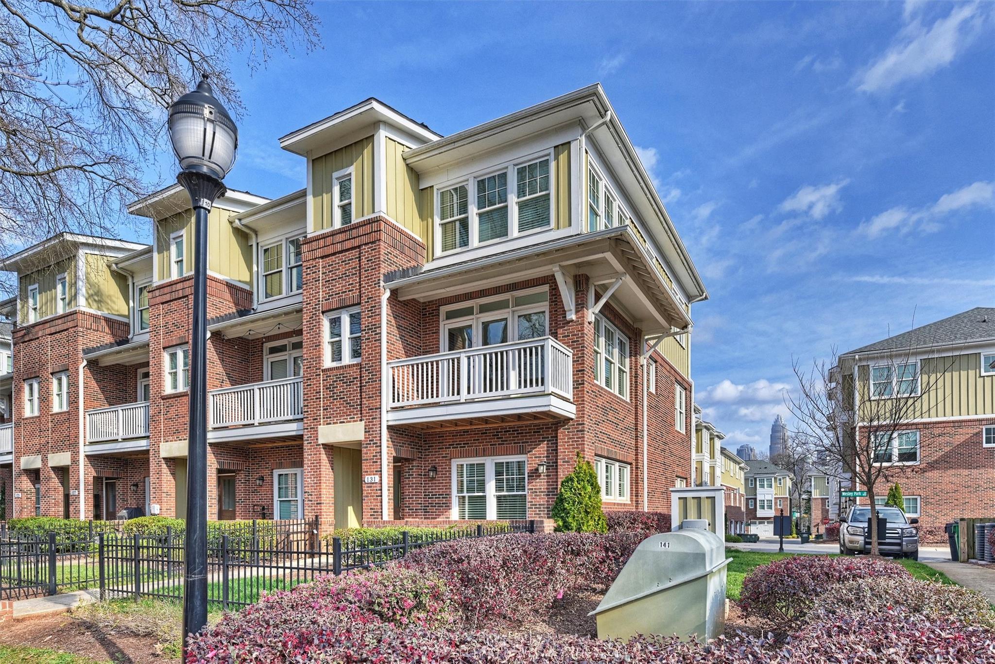 131 Grandin Road Charlotte, NC 28208 - Photo 4 of 45 a front view of a residential apartment building with a yard