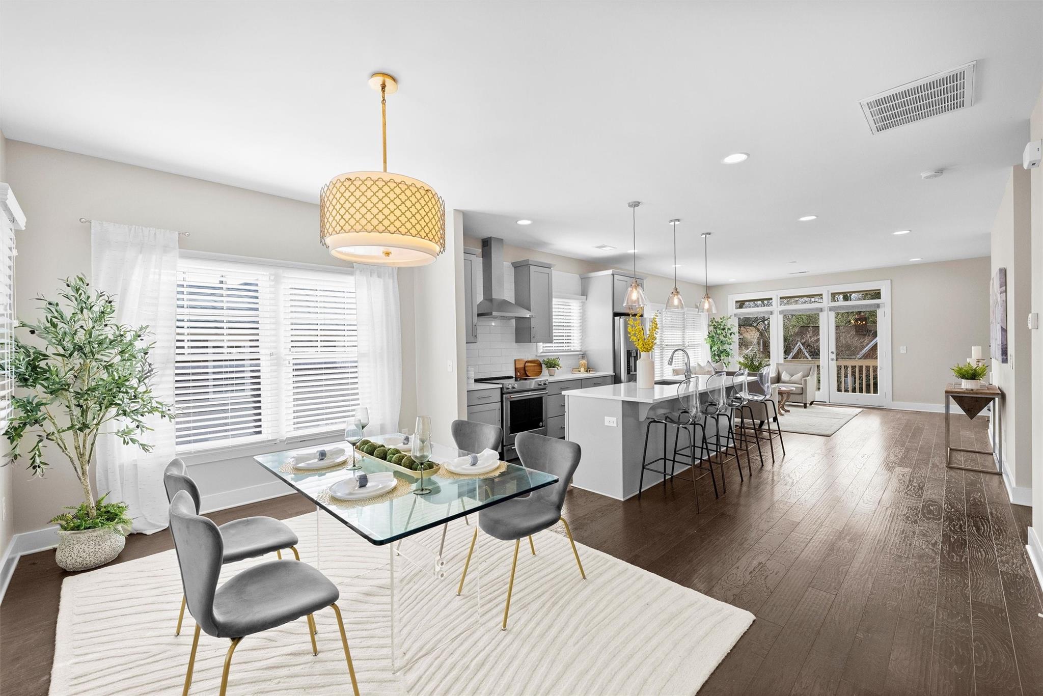 131 Grandin Road Charlotte, NC 28208 - Photo 7 of 45 a living room with furniture dining table and a large window