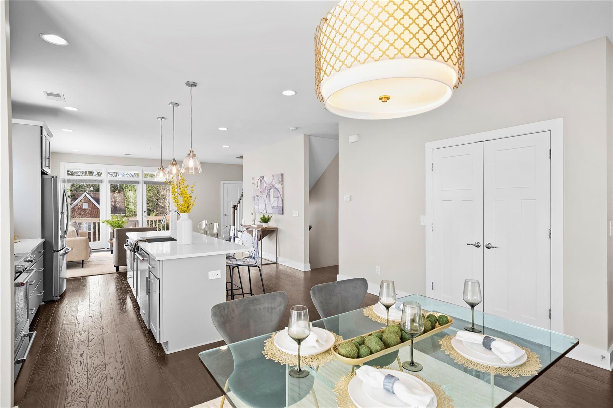 131 Grandin Road Charlotte, NC 28208 - Photo 9 of 45 an open kitchen with dining table and chairs