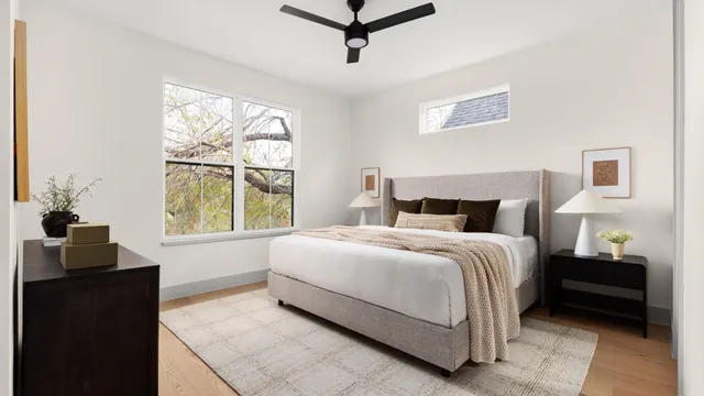 a bedroom with a bed and a window