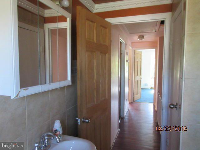 5703 Whitby Road Baltimore, MD 21206 - Photo 11 of 16 a bathroom with a toilet