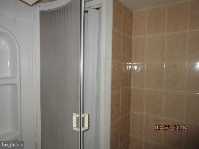 5703 Whitby Road Baltimore, MD 21206 - Photo 12 of 16 a bathroom with a shower