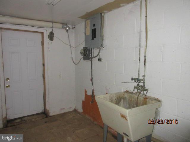 5703 Whitby Road Baltimore, MD 21206 - Photo 13 of 16 a bathroom with a bathtub and a shower