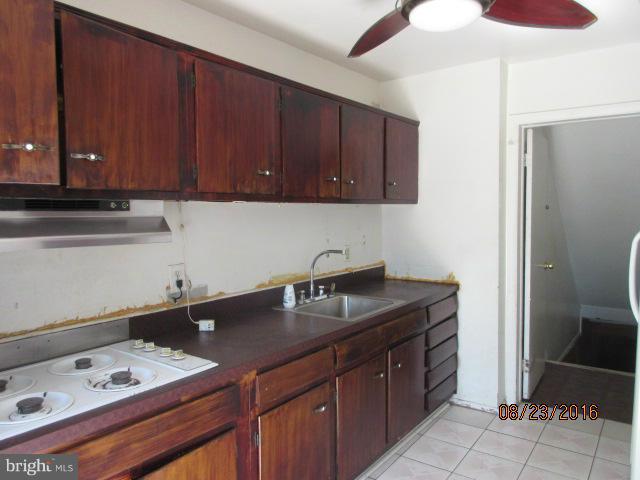 5703 Whitby Road Baltimore, MD 21206 - Photo 6 of 16 a kitchen with a sink and cabinets