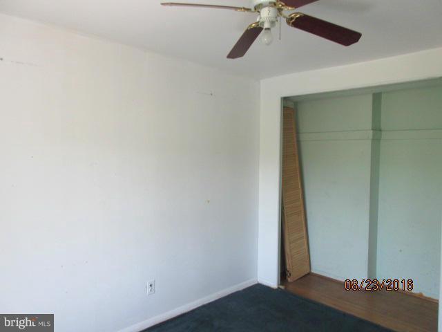 5703 Whitby Road Baltimore, MD 21206 - Photo 8 of 16 wooden floor in an empty room