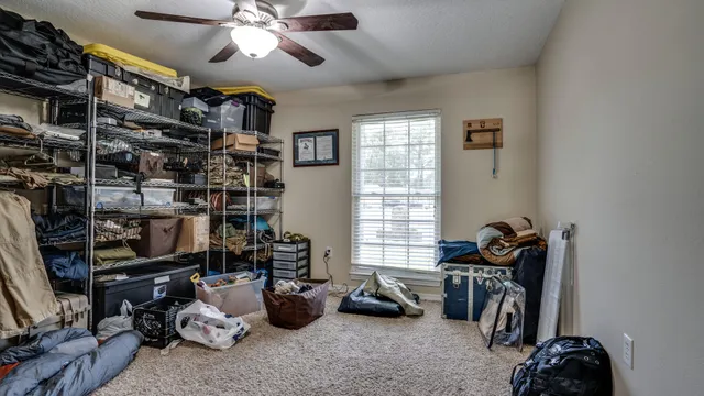 a bed room with furniture and a window