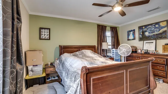 a bed room with a bed and a chandelier