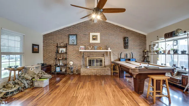a workspace with furniture window and wooden floor